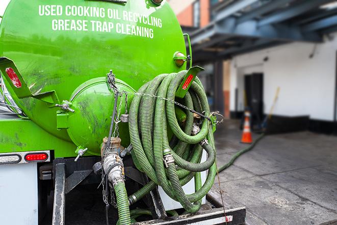 routine pumping of grease trap at a cafeteria in Belmont